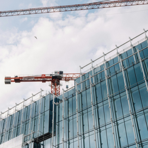 Crane working on a building under construction.